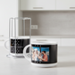 Two mugs with personalized designs on a kitchen counter.